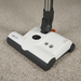 White and black vacuum cleaner powerhead with 'SEBO ET-1' branding on carpet. Capital Vacuum Raleigh Cary NC