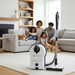Sebo vacuum cleaner on a carpet with a family and pet in the background. Sebo Airbelt D4 White Canister Vacuum 90941AM Capital Vacuum Raleigh Cary NC