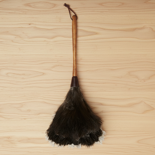Traditional ostrich feather duster on a wooden surface