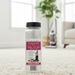Fragrance Lite Carpet and vacuum freshener bottle on a carpeted floor with a vacuum cleaner in the background. Capital Vacuum Raleigh Cary NC