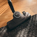 Miele Boost CX1 Lotus white SNRE0 combo tool on floor rug. Capital Vacuum Raleigh Cary NC