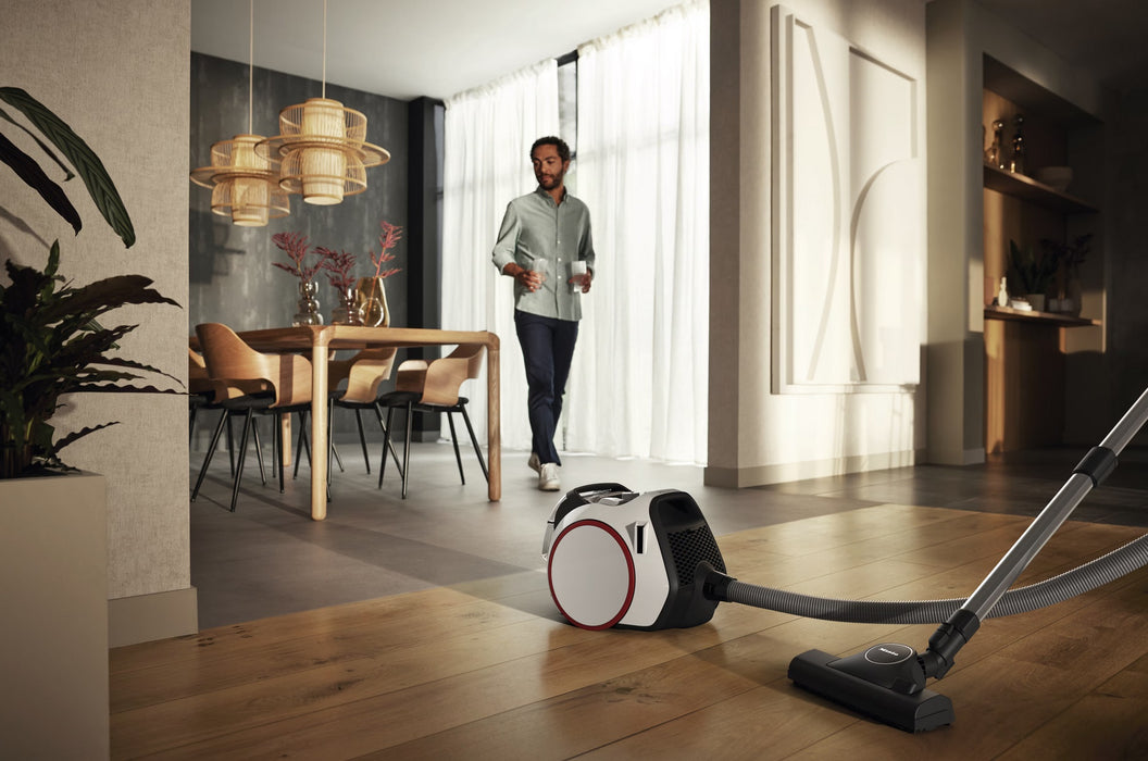 Miele Boost CX1 Lotus white SNRE0 in dining room. Capital Vacuum Raleigh Cary NC