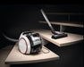 Miele Boost CX1 Lotus white SNRE0 on stairs. Capital Vacuum Raleigh Cary NC