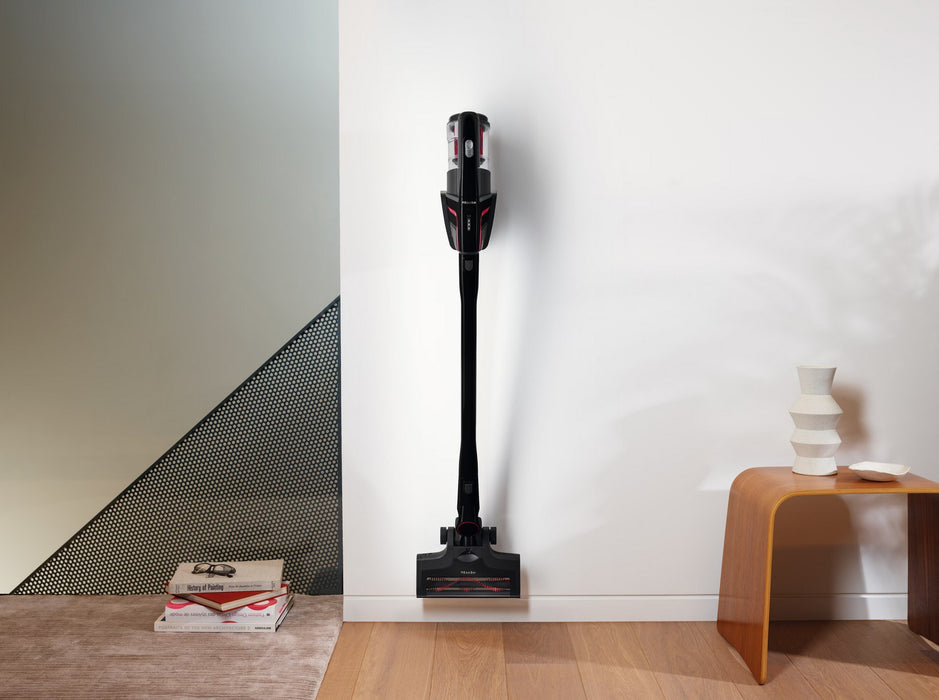 Miele Triflex HX1 Cordless White SMML5 on wall. Capital Vacuum Raleigh Cary NC