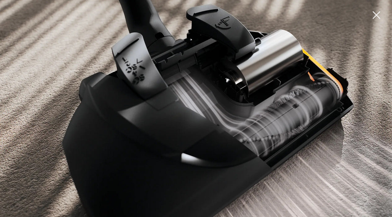 Close-up of a Miele vacuum cleaner SEB228 power nozzle head on a carpet. Miele Guard L1 Electro Titanium PF SUFE0 Canister Vacuum Cleaner Capital Vacuum Raleigh Cary NC