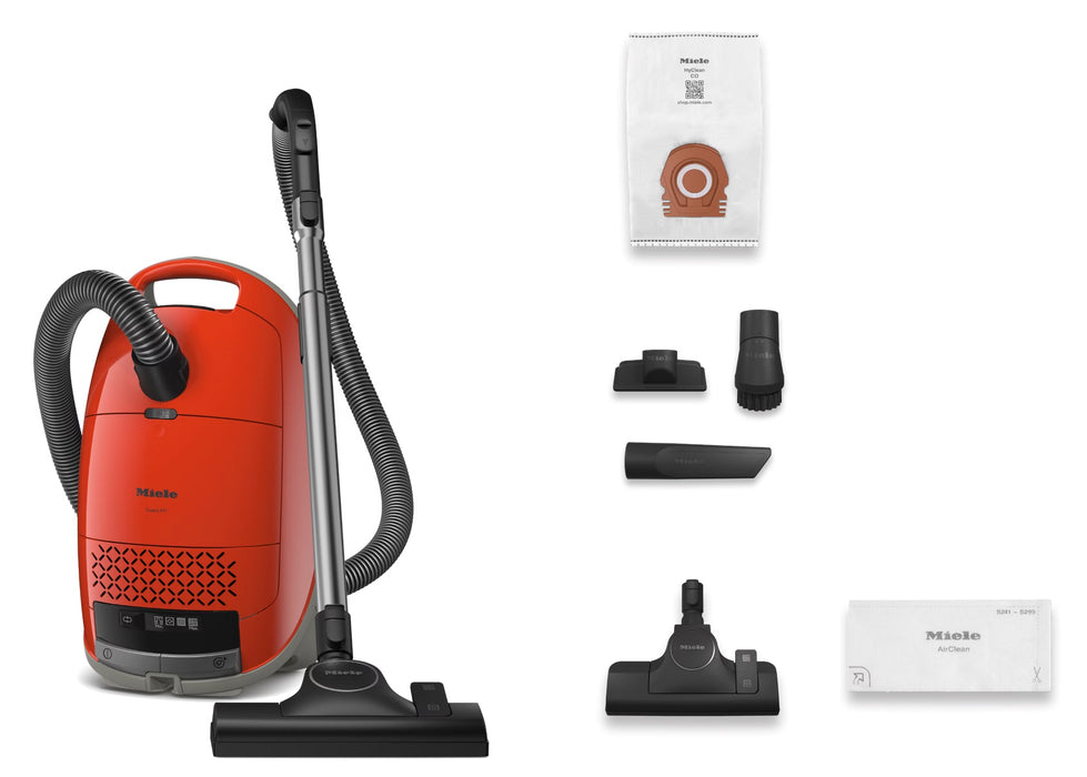 Red Miele vacuum cleaner with attachments and filters on a white background. Miele Guard M1 Terra Red SVWE0 Canister Vacuum Cleaner Capital Vacuum Raleigh Cary NC