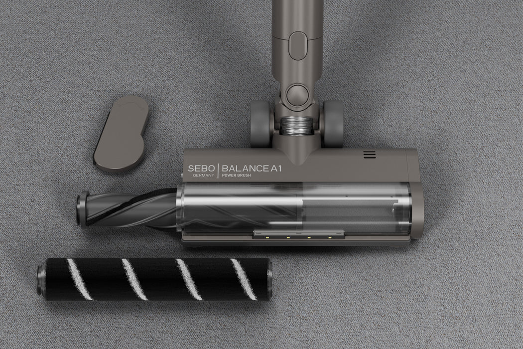 SEBO Balance A1 vacuum cleaner head with attachments. SEBO Balance A1 vacuum cleaner head on a carpet and wooden floor. Sebo Balance A1 Cordless Vacuum 95012AM Magenta Capital Vacuum Raleigh Cary NC