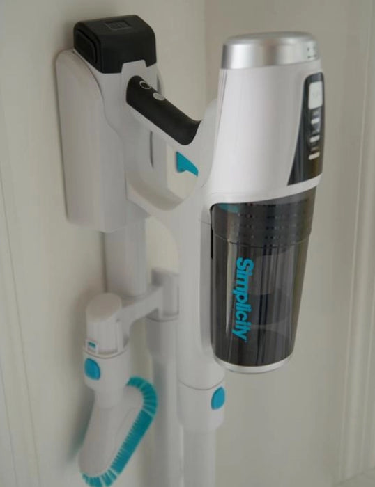 Simplicity brand handheld vacuum cleaner attached to a wall mount on a white background. Simplicity S67 cordless vacuum cleaner. Capital Vacuum Raleigh Cary NC